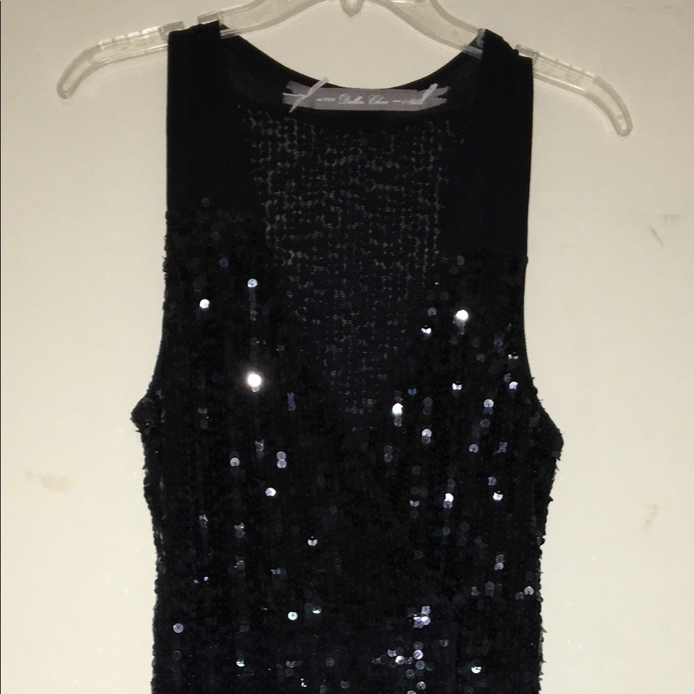 Gorgeous black sequin wrap dress.  Size Medium.